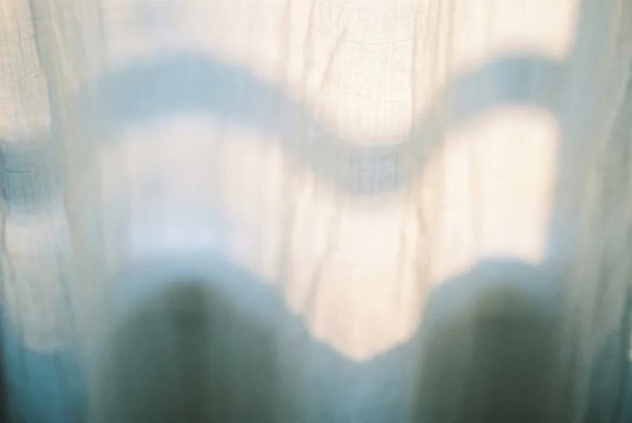 Soft daylight through a sheer linen curtain